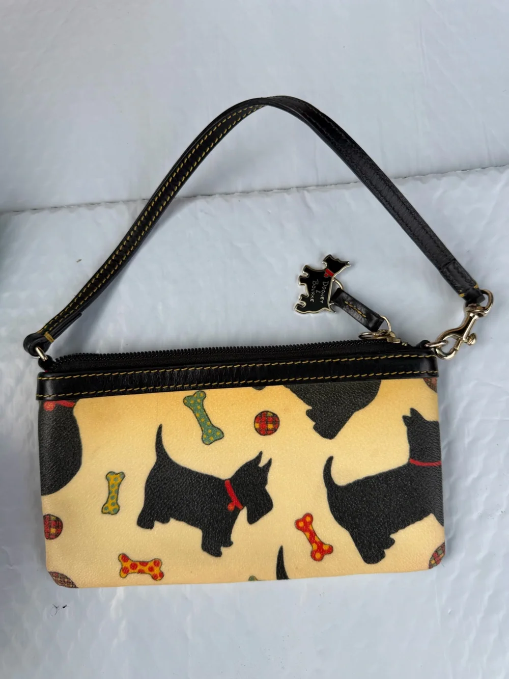 Dooney & Bourke Black Scottie Dog Print Wristlet with Cream Background